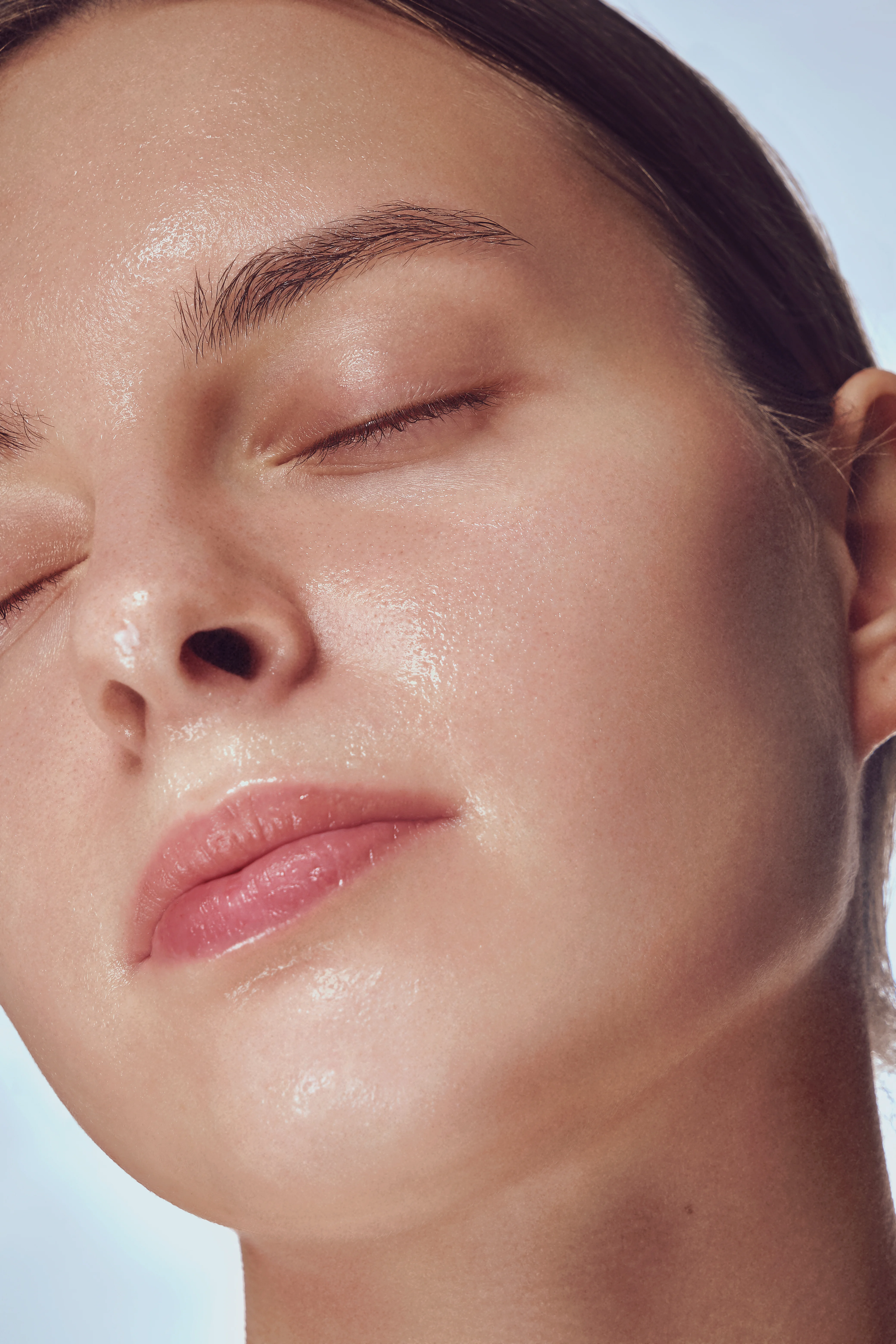 Close-up of a woman’s face marked for a laser skin treatment