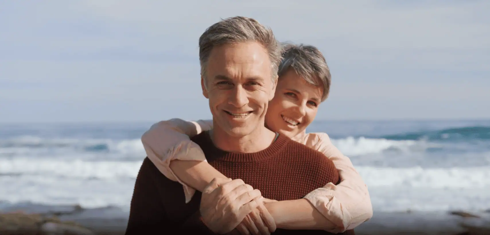Couple smiling on the beach